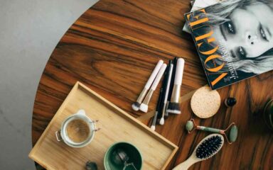 table with magazine, brushes and hairbrush