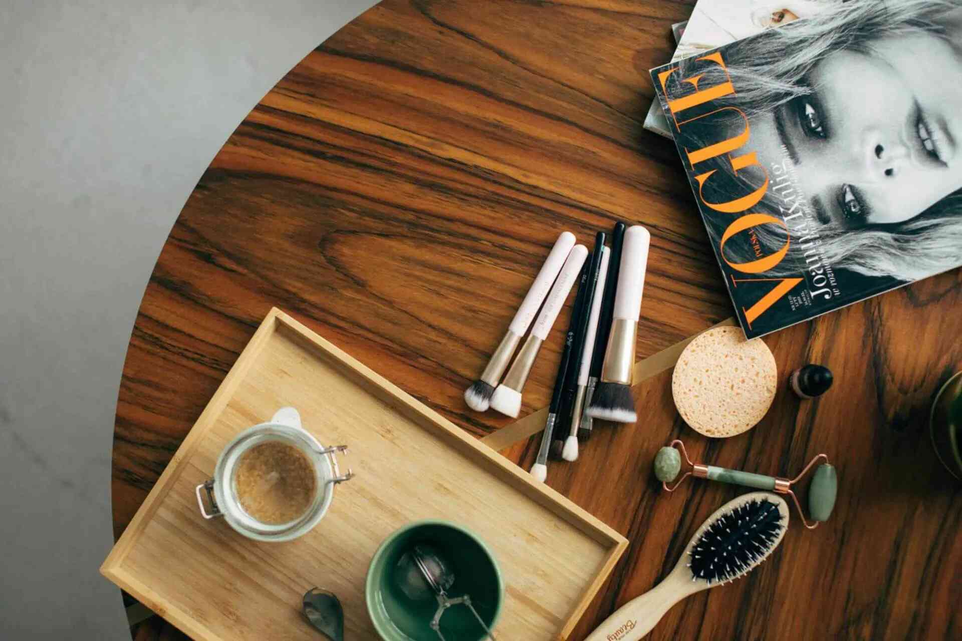 table with magazine, brushes and hairbrush