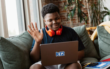 boy saying hi to the virtual meeting